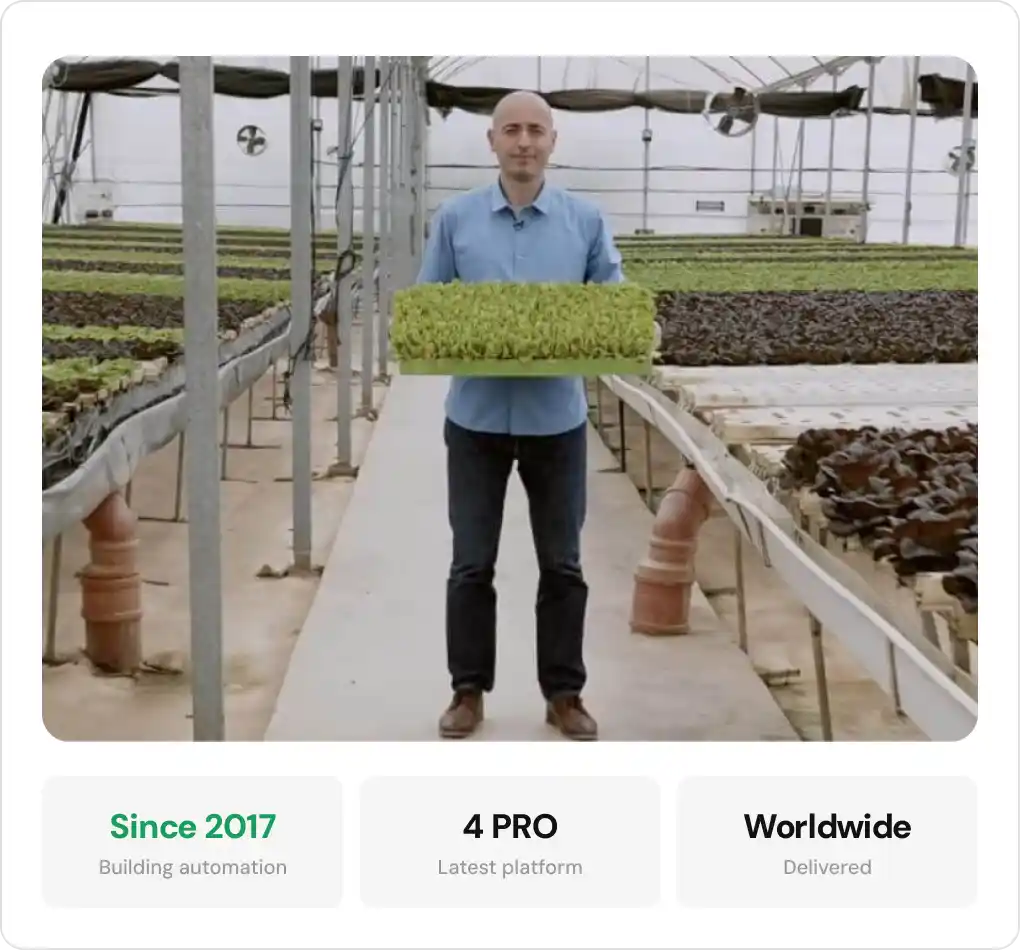 GrowDirector's CEO inside the greenhouse equipped with intelligent climate control system