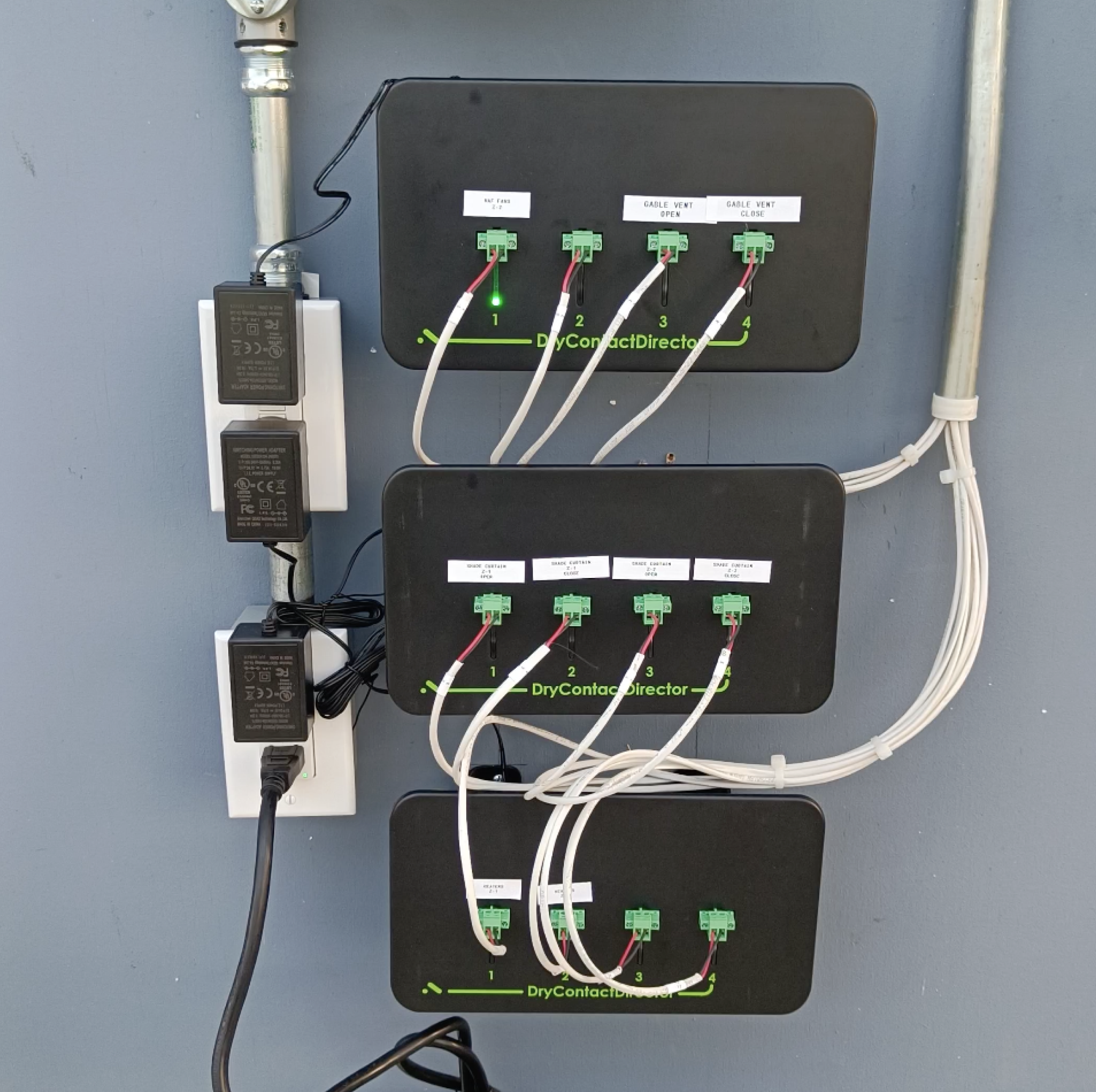 A GrowDirector control panel monitoring and automating HVAC systems in a DWC hydroponics greenhouse, ensuring precise environmental control for leafy green production.