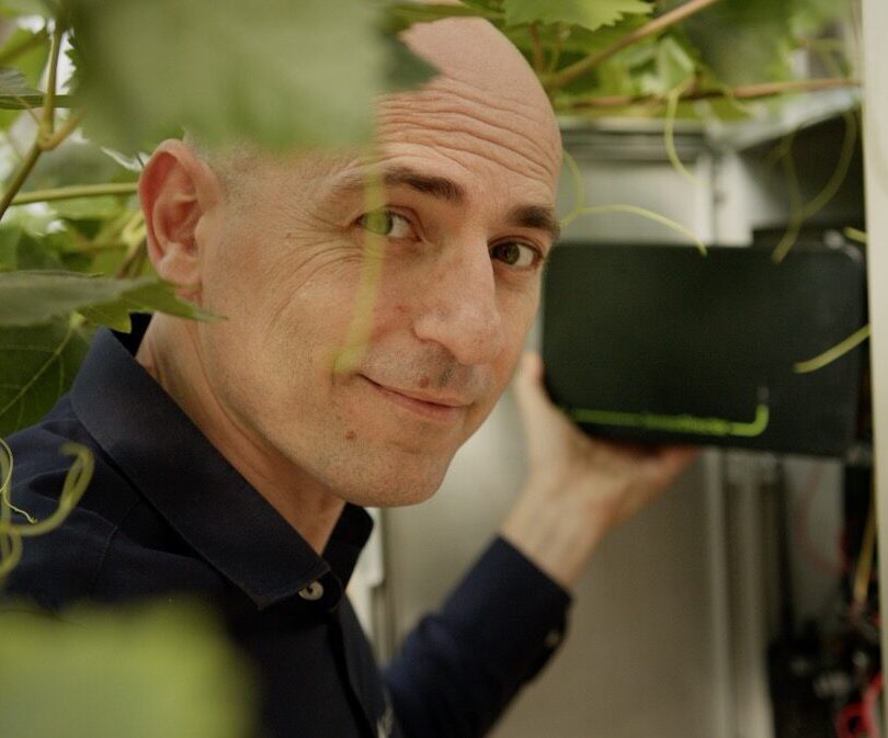 GrowDirector CEO Dima Chernobilsky holding a 4PRO sensor controller